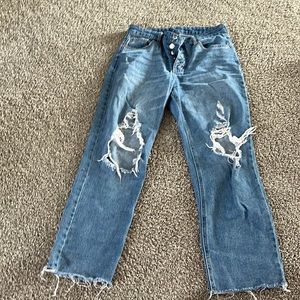 High wasted, button fly distressed jeans